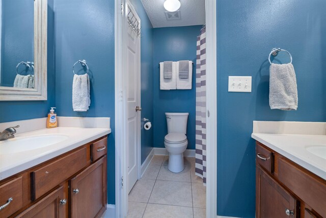 201 N Saxxon Rd, Saint Augustine, FL 32092 - full bath featuring visible vents, vanity, tile patterned floors, baseboards, and toilet