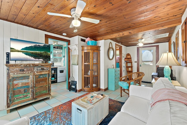 tiled living area featuring wood ceiling, visible vents, and ceiling fan