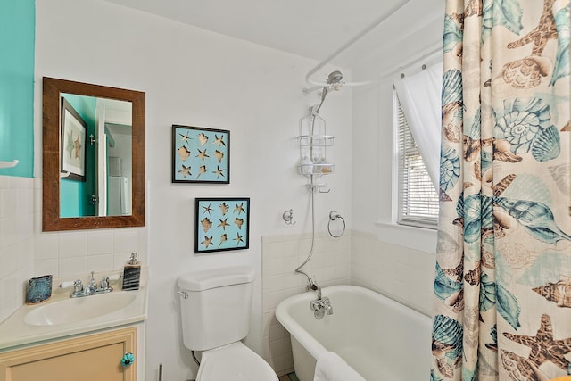 full bath with tasteful backsplash, vanity, and toilet