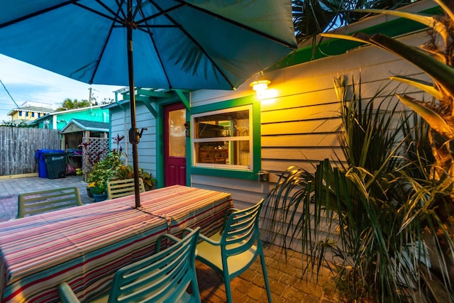 view of patio with fence and outdoor dining area