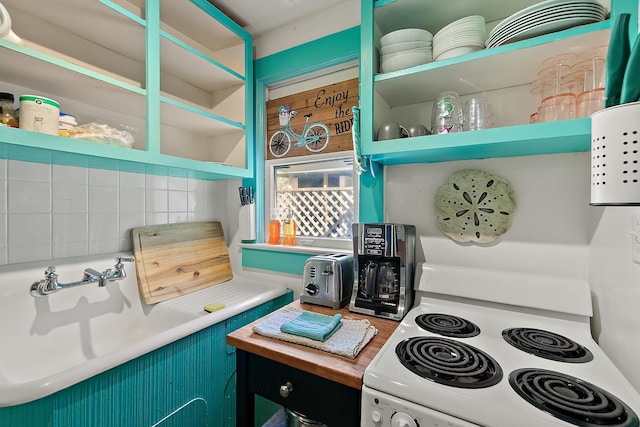 kitchen with backsplash, a toaster, open shelves, and white electric range oven