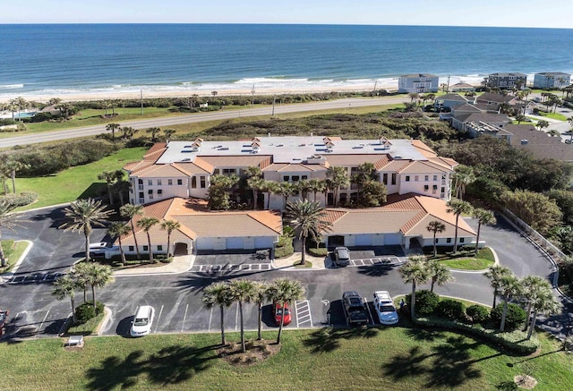 bird's eye view featuring a residential view, a water view, and a view of the beach