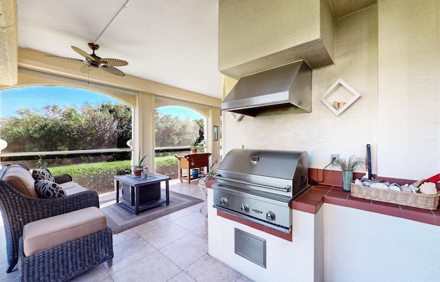 view of patio / terrace with ceiling fan, an outdoor living space, area for grilling, and grilling area