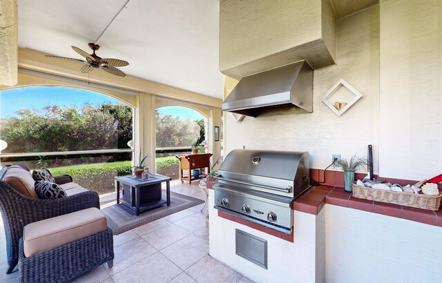 view of patio / terrace with an outdoor hangout area, area for grilling, exterior kitchen, and a ceiling fan