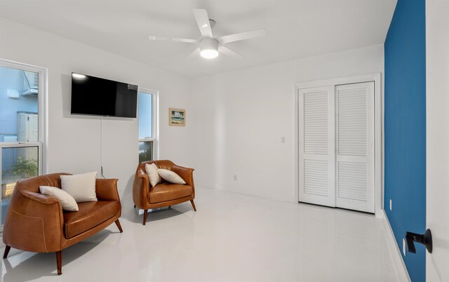 101 Dolphin Dr, Saint Augustine, FL 32080 - sitting room featuring a ceiling fan and finished concrete flooring