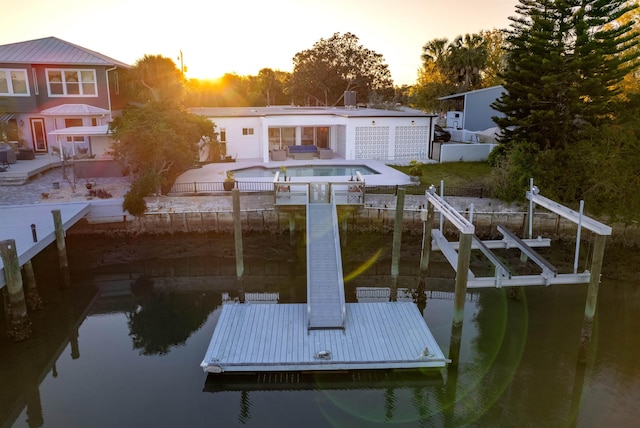 101 Dolphin Dr, Saint Augustine, FL 32080 - dock area with an outdoor pool, a fenced backyard, boat lift, a patio, and a water view