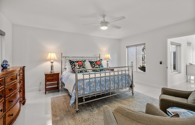 101 Dolphin Dr, Saint Augustine, FL 32080 - bedroom featuring baseboards, concrete floors, and ceiling fan