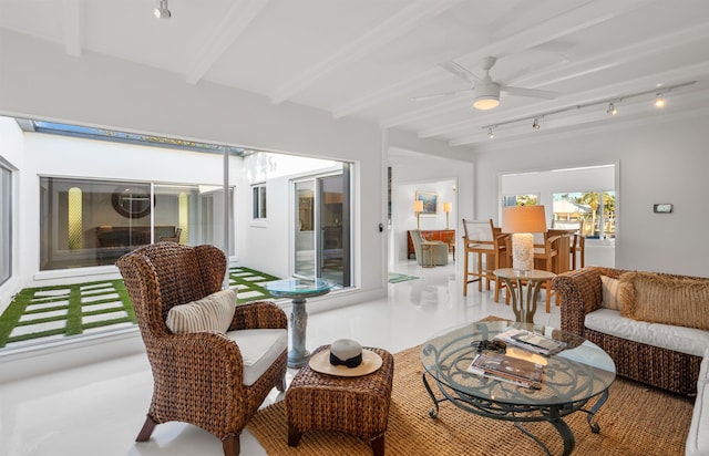 101 Dolphin Dr, Saint Augustine, FL 32080 - living area with rail lighting, ceiling fan, and beamed ceiling