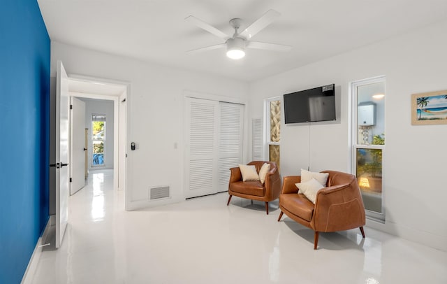101 Dolphin Dr, Saint Augustine, FL 32080 - sitting room featuring a ceiling fan, finished concrete floors, and visible vents