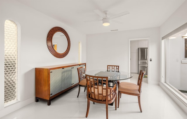 101 Dolphin Dr, Saint Augustine, FL 32080 - dining room featuring baseboards, visible vents, finished concrete floors, and a ceiling fan