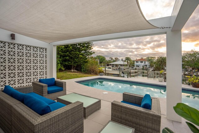 101 Dolphin Dr, Saint Augustine, FL 32080 - pool at dusk featuring outdoor lounge area, an outdoor pool, and a patio