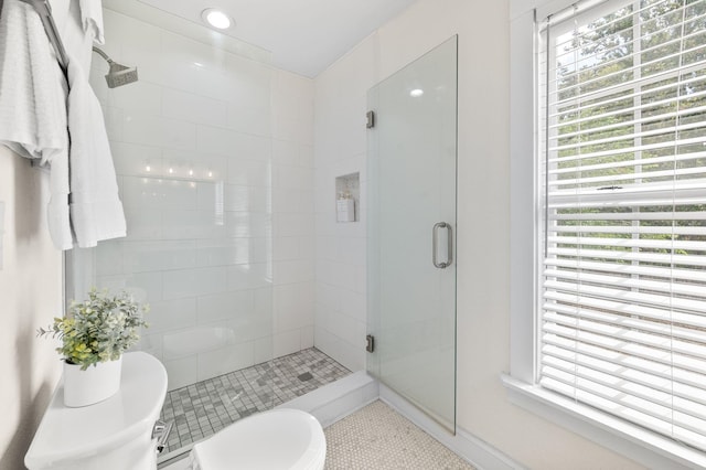 91 Saint Benedict St, Saint Augustine, FL 32084 - full bath with a stall shower, healthy amount of natural light, toilet, and tile patterned floors