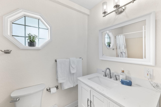91 Saint Benedict St, Saint Augustine, FL 32084 - bathroom featuring toilet, vanity, and a shower with curtain