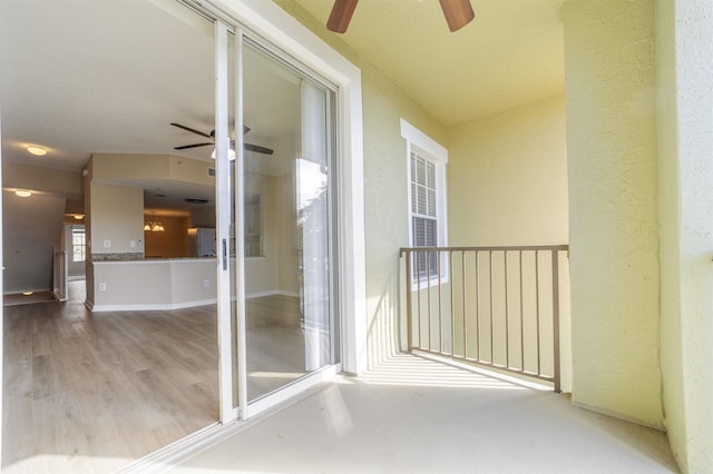 exterior space featuring ceiling fan