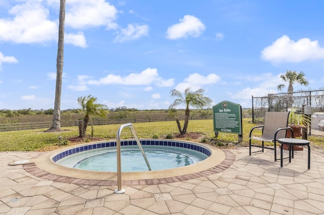 view of swimming pool featuring a community hot tub and fence