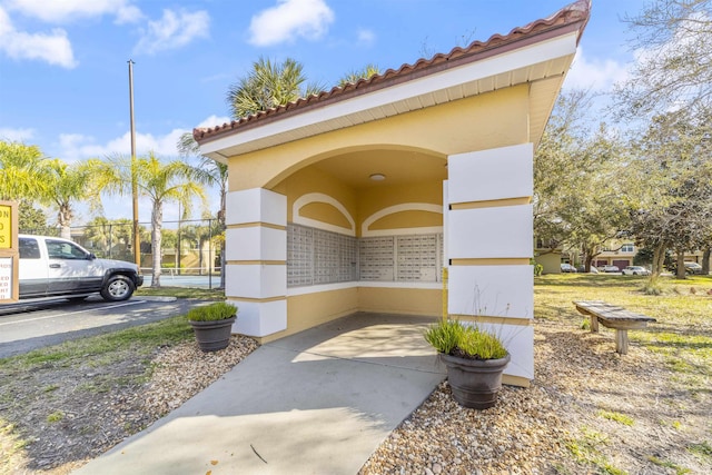 surrounding community with uncovered parking and fence
