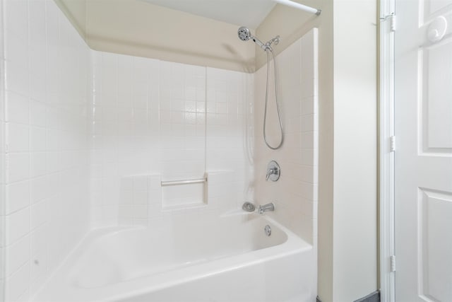 bathroom with shower / washtub combination