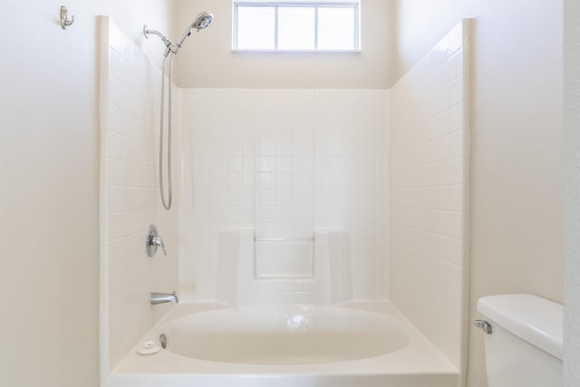 full bathroom with shower / bath combination and toilet