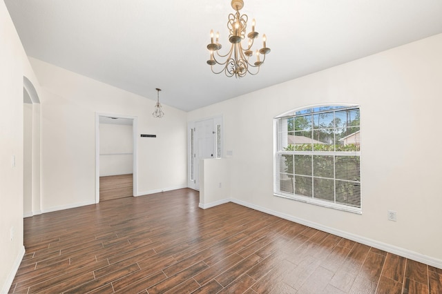 17 Porter Ln, Palm Coast, FL 32164 - unfurnished room with a chandelier, lofted ceiling, dark wood-style flooring, and baseboards
