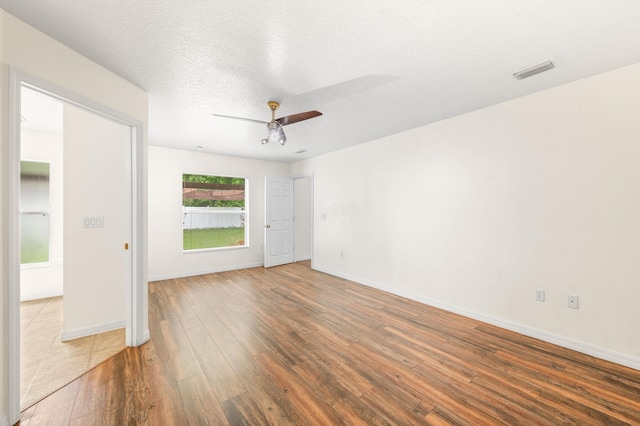 17 Porter Ln, Palm Coast, FL 32164 - unfurnished bedroom with hardwood / wood-style floors, baseboards, and a ceiling fan