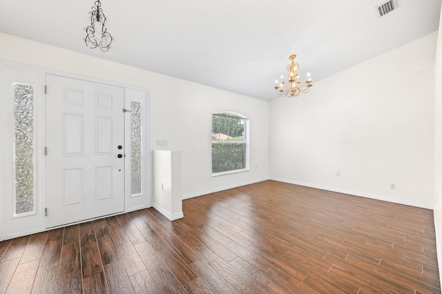 17 Porter Ln, Palm Coast, FL 32164 - foyer entrance with a chandelier, wood finished floors, and baseboards