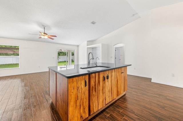 17 Porter Ln, Palm Coast, FL 32164 - kitchen with a sink, vaulted ceiling, dark wood-style floors, and baseboards