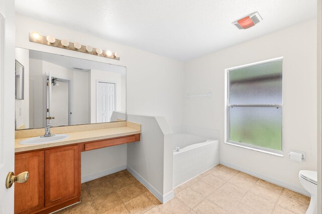 17 Porter Ln, Palm Coast, FL 32164 - full bath featuring a bath, vanity, toilet, and baseboards