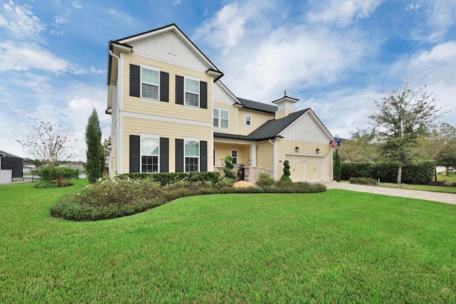 view of front facade with a garage and a front yard