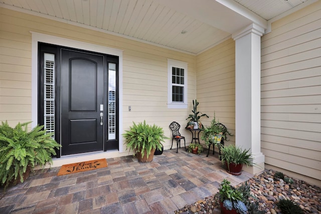 entrance to property featuring a porch