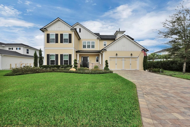 view of front of property featuring a garage and a front yard