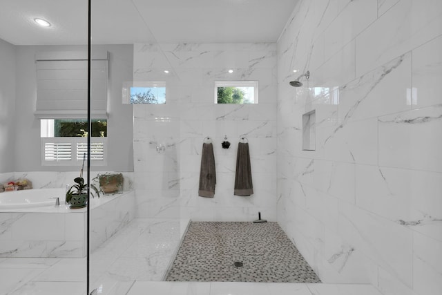 bathroom featuring plus walk in shower