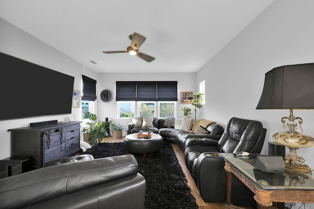 living room featuring ceiling fan and wood-type flooring