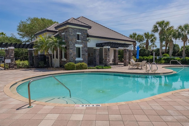 485 Ocean Forest Dr, Saint Augustine, FL 32080 - community pool with a pergola, fence, and a patio