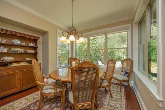 485 Ocean Forest Dr, Saint Augustine, FL 32080 - dining space with crown molding, baseboards, a chandelier, and wood finished floors