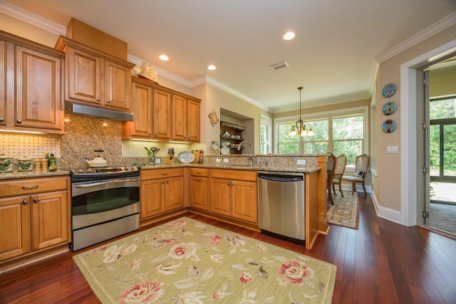 485 Ocean Forest Dr, Saint Augustine, FL 32080 - kitchen featuring appliances with stainless steel finishes, brown cabinetry, under cabinet range hood, visible vents, and dark wood-style flooring