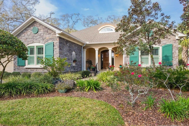 485 Ocean Forest Dr, Saint Augustine, FL 32080 - view of front facade with a shingled roof and stone siding