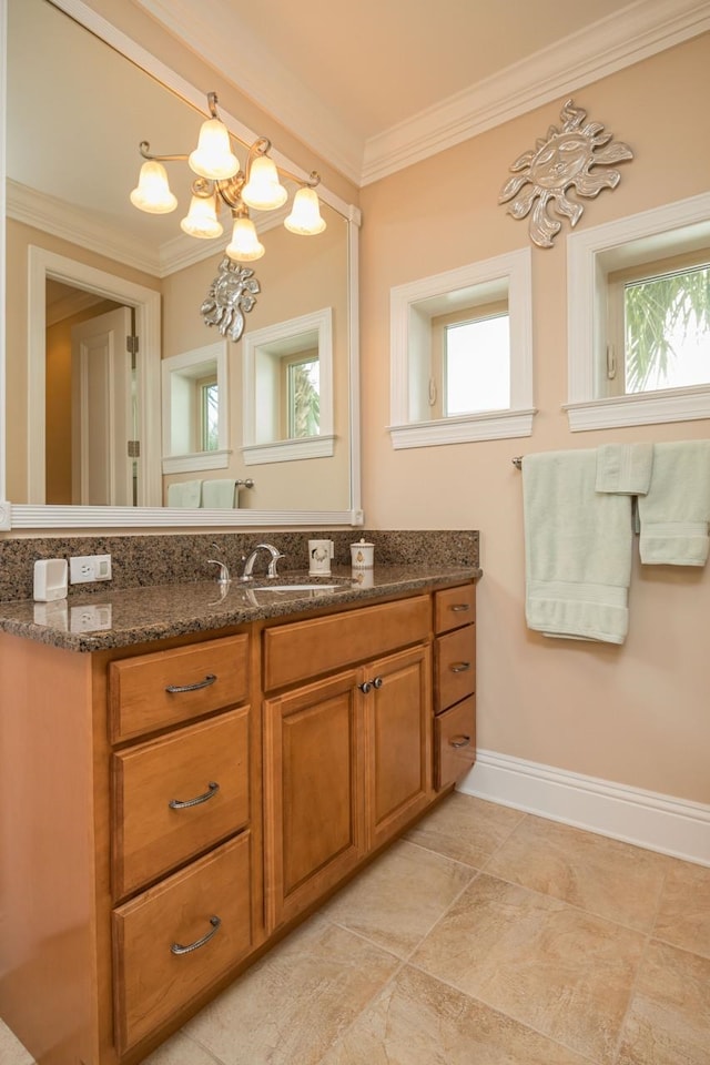 485 Ocean Forest Dr, Saint Augustine, FL 32080 - bathroom with baseboards, crown molding, vanity, and an inviting chandelier