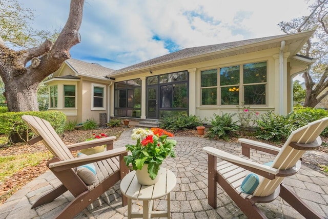 485 Ocean Forest Dr, Saint Augustine, FL 32080 - rear view of house with a patio, a sunroom, and a shingled roof