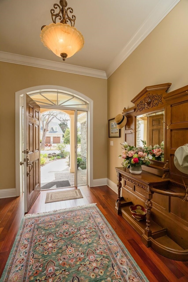 485 Ocean Forest Dr, Saint Augustine, FL 32080 - entrance foyer with baseboards, wood finished floors, and crown molding