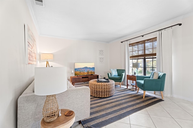 sitting room with crown molding, light tile patterned floors, and visible vents