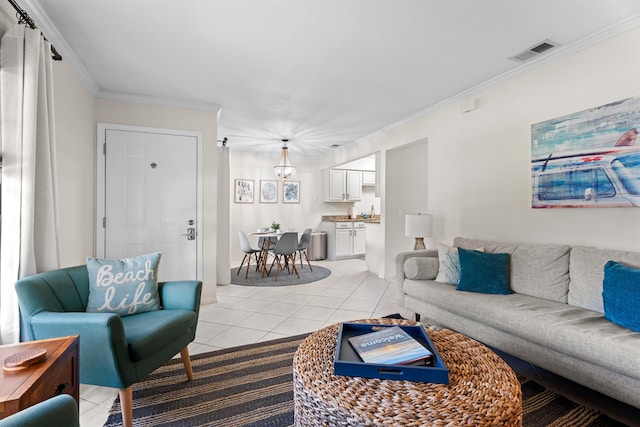 living area featuring crown molding, light tile patterned floors, and visible vents