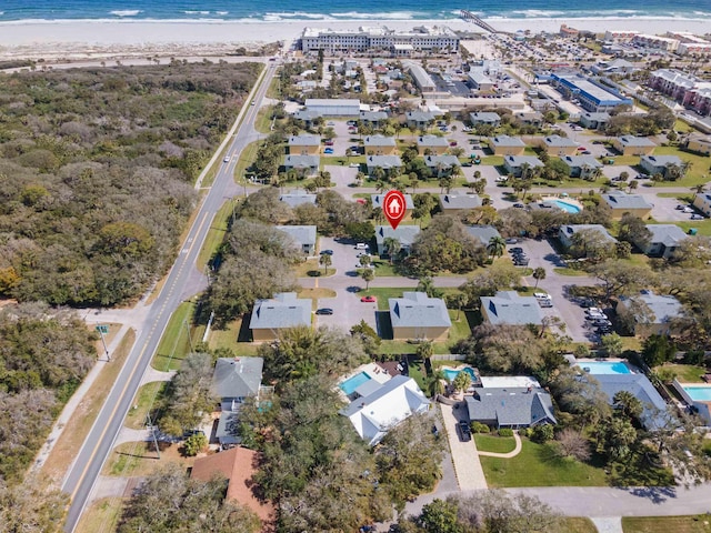 birds eye view of property with a residential view, a water view, and a view of the beach