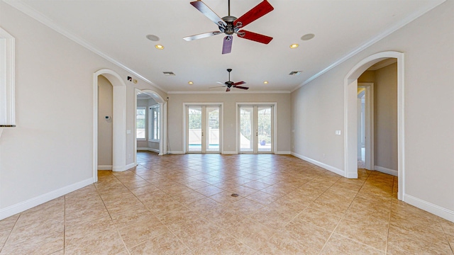 unfurnished room featuring ceiling fan, light tile patterned floors, crown molding, and french doors