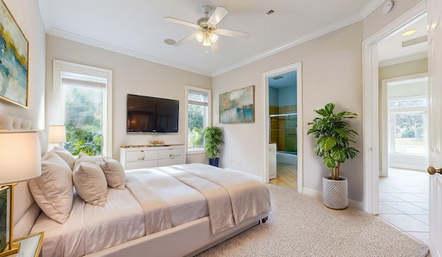 bedroom featuring light tile patterned floors, ensuite bath, multiple windows, and ceiling fan