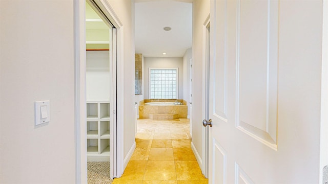 corridor with light tile patterned floors