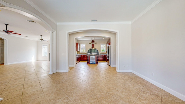 hallway featuring light tile patterned floors, beverage cooler, and ornamental molding