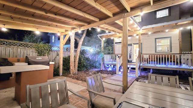 view of patio / terrace featuring area for grilling, outdoor dining area, and fence