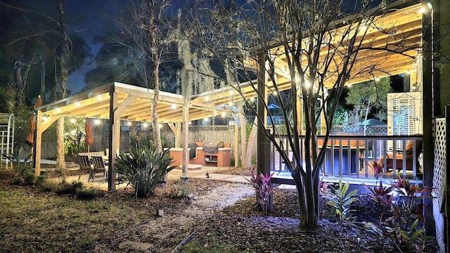 view of yard featuring a deck and fence