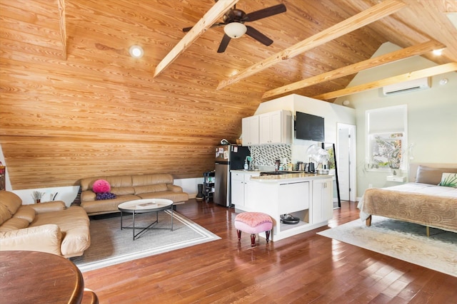 living area with vaulted ceiling with beams, wooden ceiling, an AC wall unit, and hardwood / wood-style floors