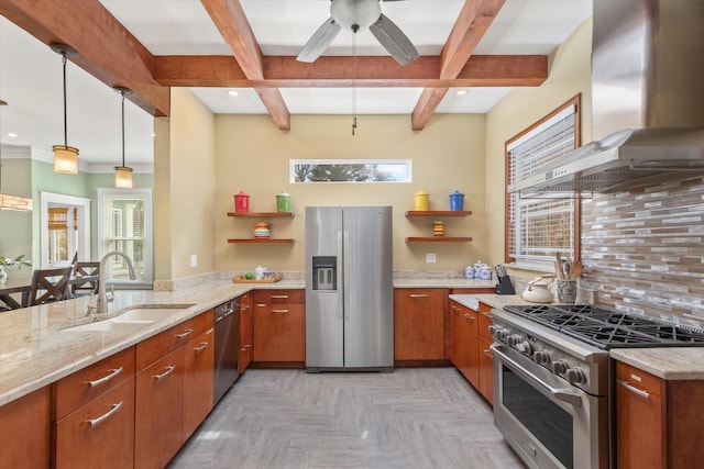 kitchen with open shelves, a sink, plenty of natural light, appliances with stainless steel finishes, and wall chimney exhaust hood